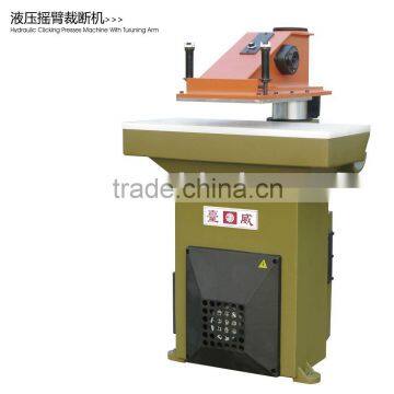 Hydraulic swing arm leather cutting machine