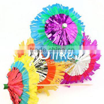 unusual fringed and layered Hawaiian party cocktail parasols in a mix of bright colours. for wedding table decoration