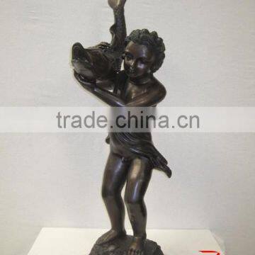 little male angel statue with fish sculpture