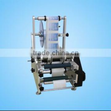 Manual round bottle labeling machine