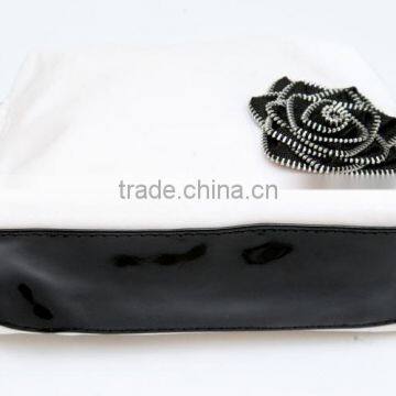 Solid colour whilte pvc with flower attached cosmetic bag