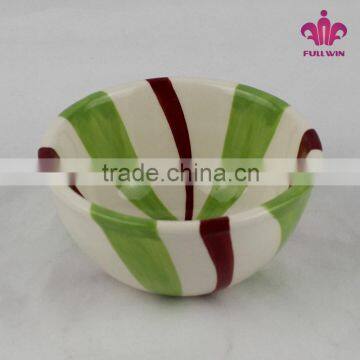 Colorful ceramic bowl with candy stripe design