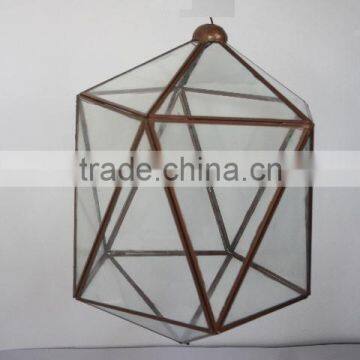 Brass and glass pendent lamp in antique brass finish