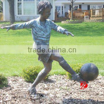 cast bronze boy playing football statues