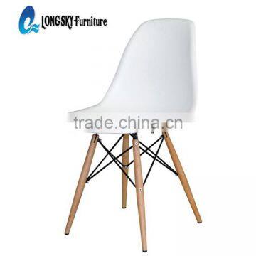 LS-4001 White ABS Charles Plastic Chair with solid wood legs in dining room