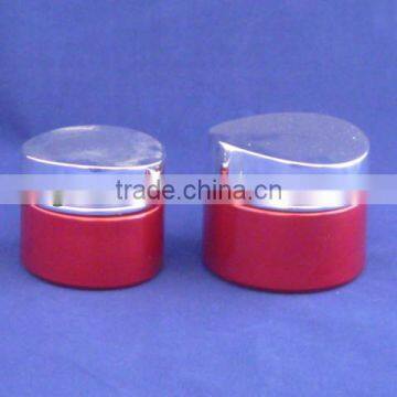 red colour glass lotion bottle and cream jar