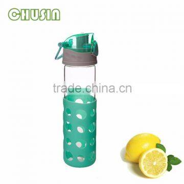 fashionable glass water bottle with unique silicone sleeve and BPA FREE PP lid and handle