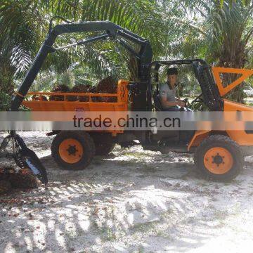Utility tractor with grapple dump box
