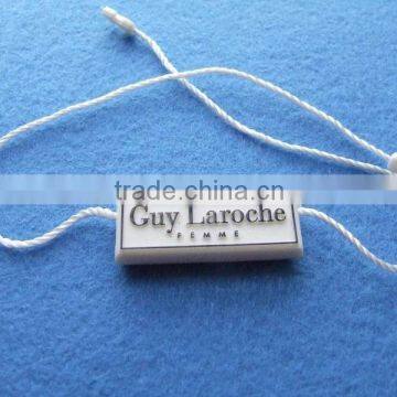 white embossed plastic string seal tags