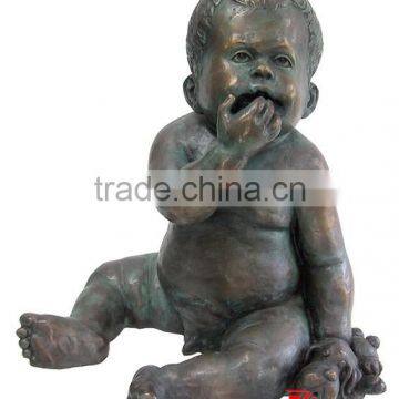 Bronze metal baby statues eating hands