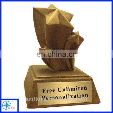 golden star resin trophy with golden painting or plating