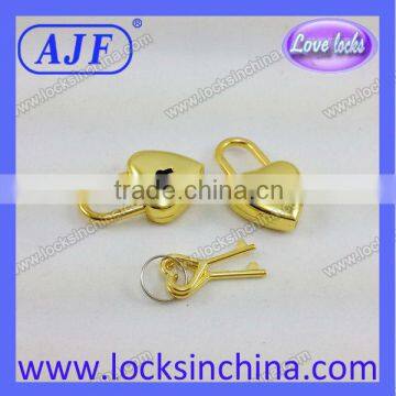 Heart shaped golden polished padlock for diary book
