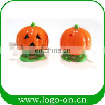 Promotional wind up pumpkin chain teeth kids jumping toys