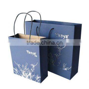 Customized brown paper clothing bag with handle