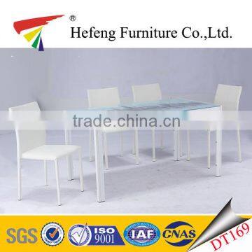 hot sale UK market white painting tempered glass dining table and white leather chairs