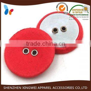 round red fabric covered sewing button with two holes