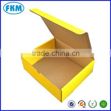 yellow folded corrugated box