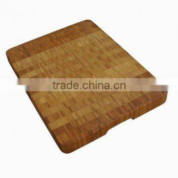 Bamboo cutting board with dent handle