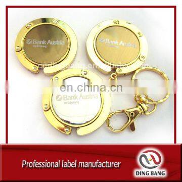 OEM Wholesale Stock Items Key chain Type And Promotion Souvenir Use Custom Blank Metal Gold Bag Hanger