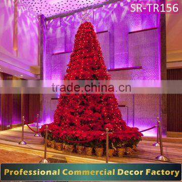 Giant interior hotel Christmas tree with flower decoration
