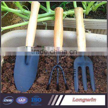 small garden shovel, fork and rake for child