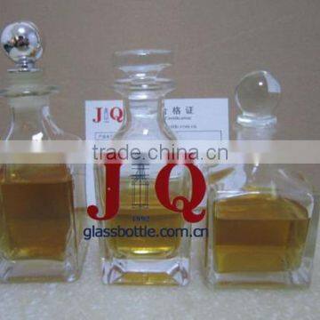 square clear glass spirit liquor bottle with glass stopper