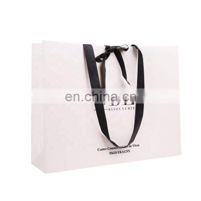 Wholesale Custom Logo Clothing Shopping Bag Packaging Gift White Kraft Paper Bag With Rope Hande photo-5