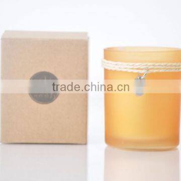 100g Scented Candle in a yellow glass jar