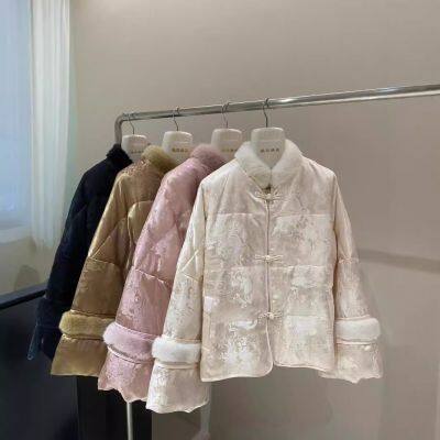 The new winter stand-up collar mink fur coat with silk jacquard buttons and thickened Chinese-style goose down jackets exude a high-end feel for women