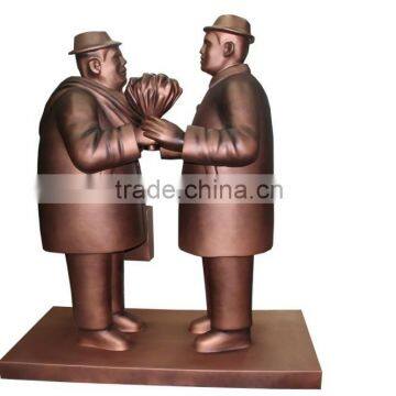 resin statue of two good friends in the color of copper