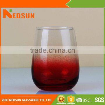 Red bottom stemless wine glass