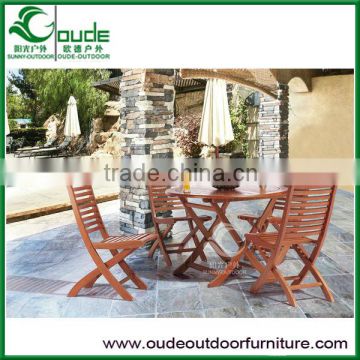 outdoor wooden furniture round table with folding chairs