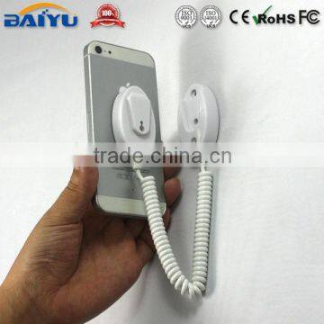 White plastic magnetic phone stand with spring wire for mobile phone shop