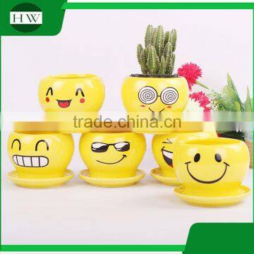 wholesale cheap mini yellow round cup shape handwork decoration smiling face cement garden flower pot