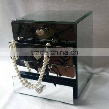 mirrored jewelry box with four drawers