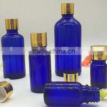 whole sale 5ml to 100ml blue glass bottle with plastic reducer and shiny golden cap