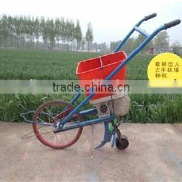 Hand corn seeder