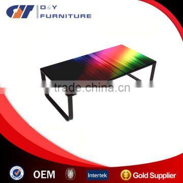 Modern coffee table with black legs & tempered glass table top in neon print