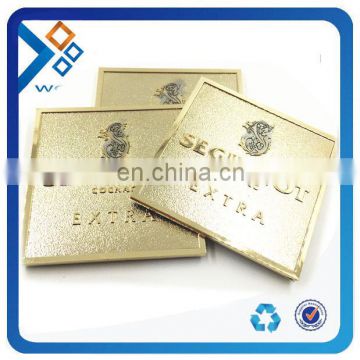 Square gold metal nameplates with engraved logo