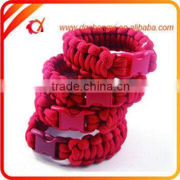 Red wholesale paracord bracelet with fire starter & whistle & scraper