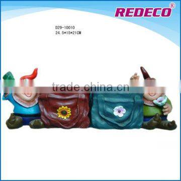 Resin gnome figurine with flower pot