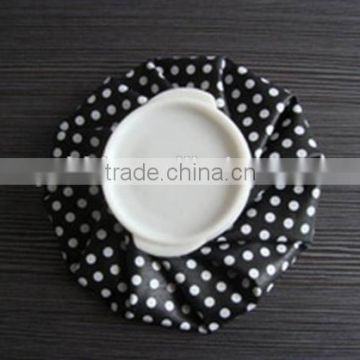 7" fabric ice bag black background with white dot