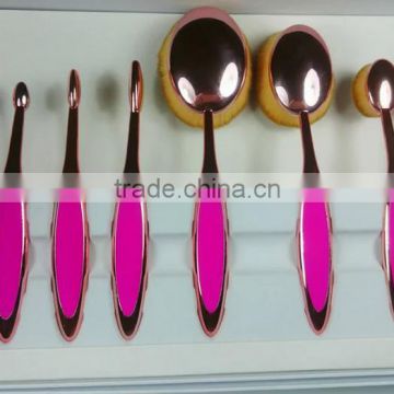 Hot sale 10pcs rose gold oval cosmetic toothbrush shape makeup brush