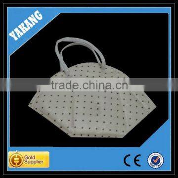 Yellow spunlace nonwoven protective face mask with valve