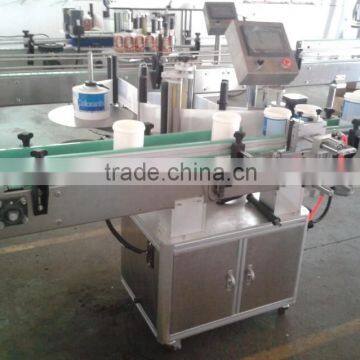 Self-adhesive bottle labeling machine