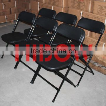 stackable black plastic resin folding chair