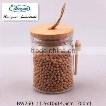 Clear Glass Jar With Wooden Lid and Spoon