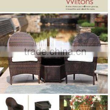 rattan outdoor furniture in brown flat wicker with cream cushion