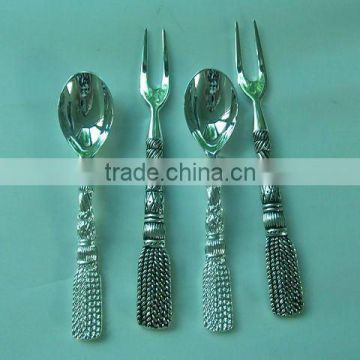 Polished stainless steel spoon with zinc alloy handle