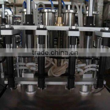 China Guangzhou Factory Small Perfume Bottle Four Head Filling Machine/equipment With Negative Pressure for Sale photo-4